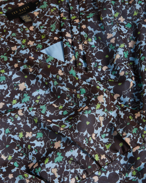 CHERELA-Dresses-It might be downright impossible to not look amazing in CHERELA. With its dropped waist and ruching on the front, pair with a sleek up-do and you're good to go.The fabric of this product is made of 100% recycled polyester. Using recycled polyester helps divert plastic waste from ending in landfills, and helps us to reduce our dependence on virgin materials. Mini dress Long sleeved V-neck Ruched front Ditsy floral print Dropped waist Awuoi is 5'10.5" / 1.79m and wears Light Blue in a Ted size